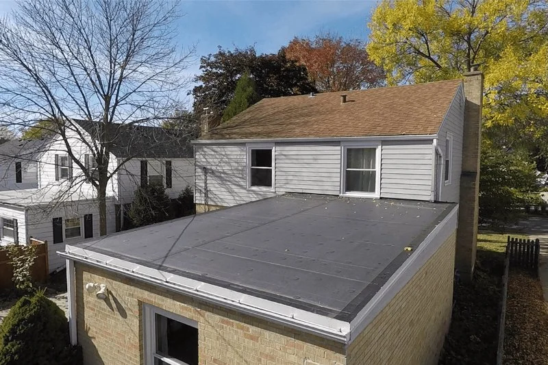 Roof Replacement for Flat Roofs: Drainage & Material Considerations | Total Roofing Hub