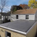 Roof Replacement for Flat Roofs: Drainage & Material Considerations | Total Roofing Hub