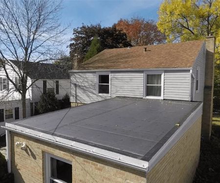 Roof Replacement for Flat Roofs: Drainage & Material Considerations | Total Roofing Hub
