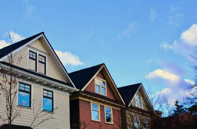 How Local Building Codes Influence Your Roof & Siding Choices