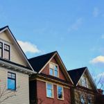How Local Building Codes Influence Your Roof & Siding Choices