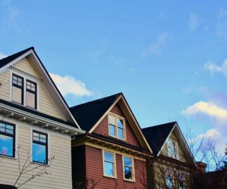 How Local Building Codes Influence Your Roof & Siding Choices